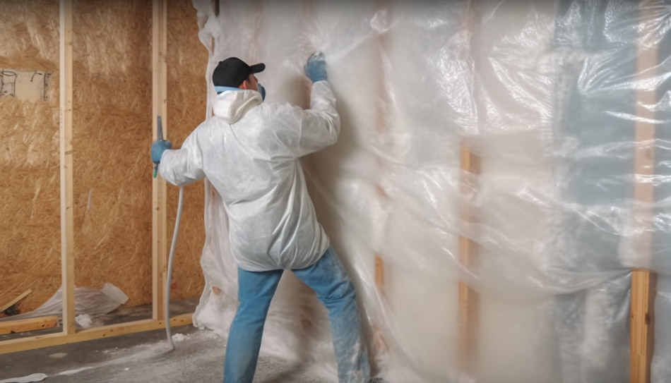 Worker installing vapor barriers.